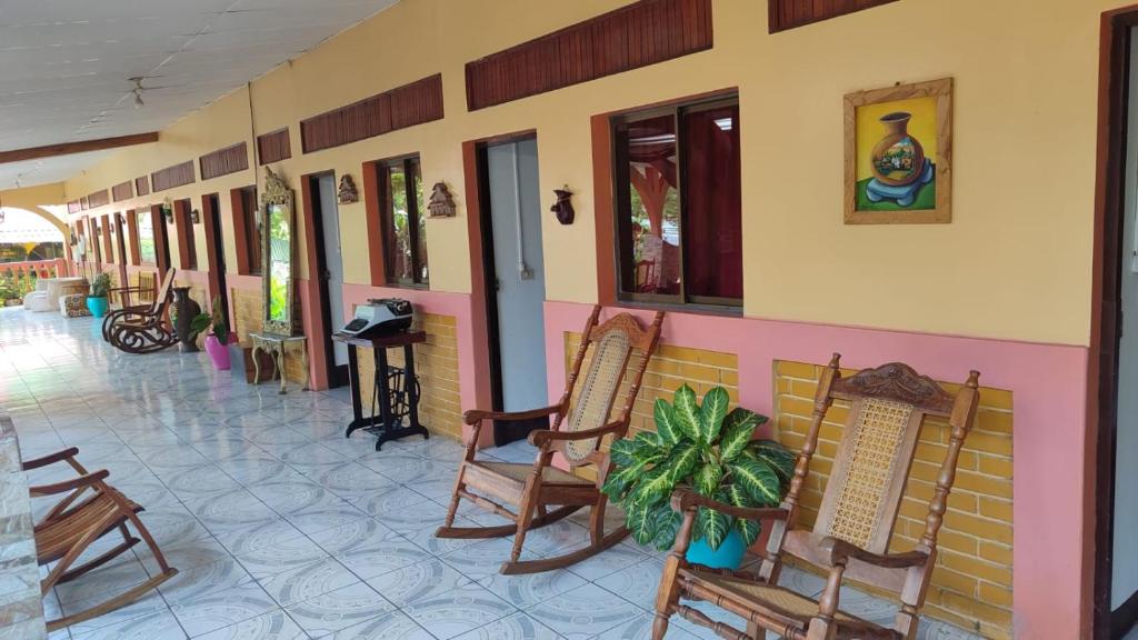 Shaded veranda and guest-room doors at Hotel Ometepetl, Moyogalpa